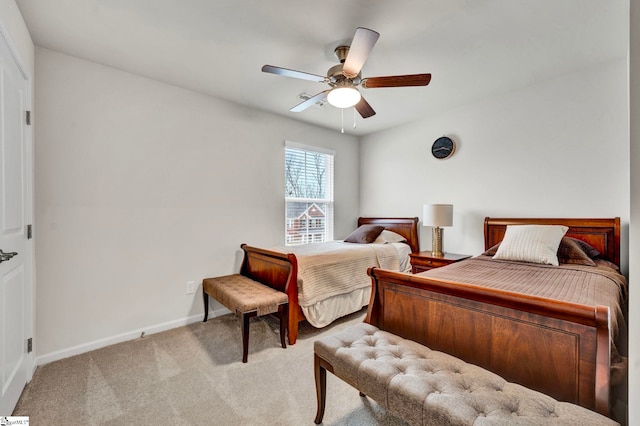 bedroom with light carpet, ceiling fan, and baseboards