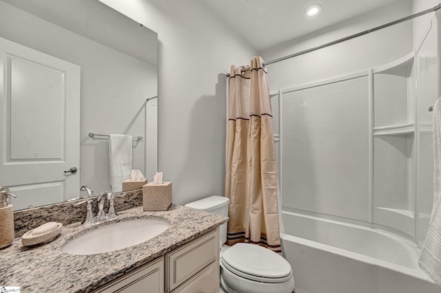 bathroom with toilet, shower / bath combination with curtain, and vanity