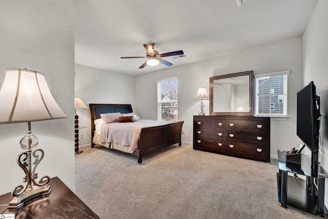 bedroom with visible vents, carpet floors, a ceiling fan, and baseboards