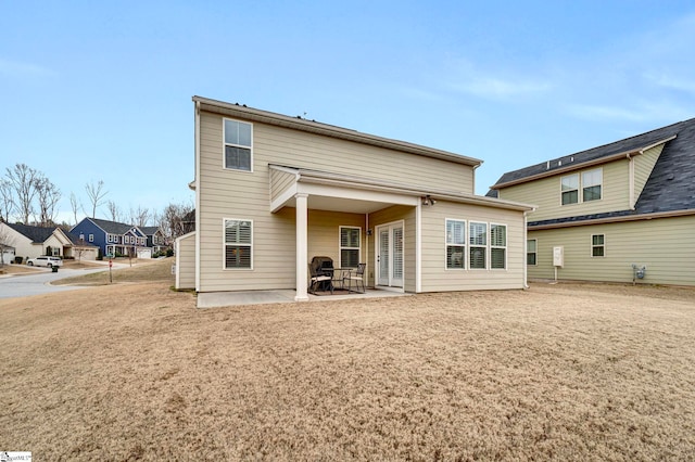 back of property featuring a patio area