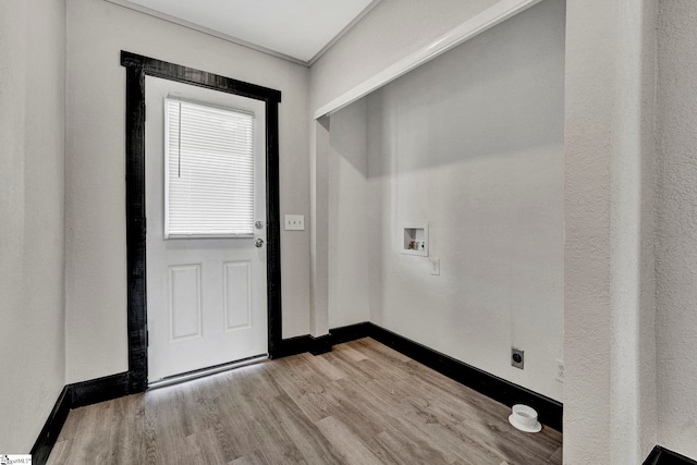 washroom with laundry area, wood finished floors, hookup for a washing machine, and baseboards