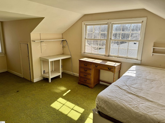 bedroom featuring carpet, baseboards, and vaulted ceiling