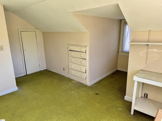 additional living space featuring lofted ceiling, carpet flooring, and baseboards