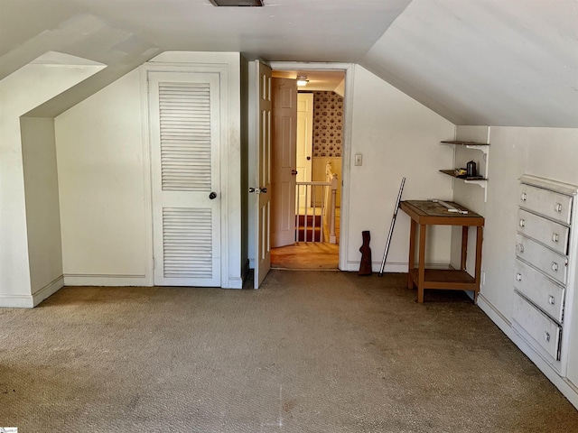 bonus room with carpet, vaulted ceiling, and baseboards