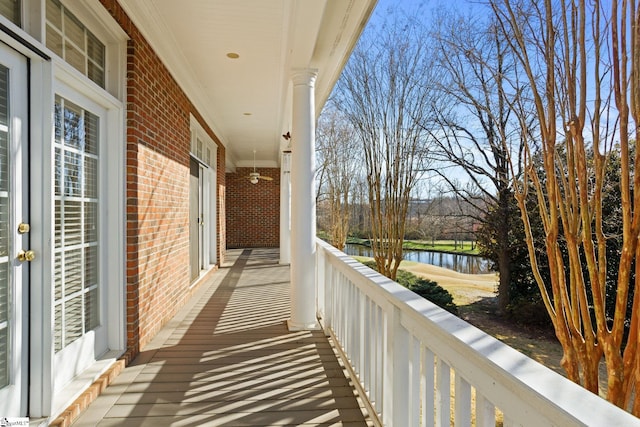 balcony featuring a water view