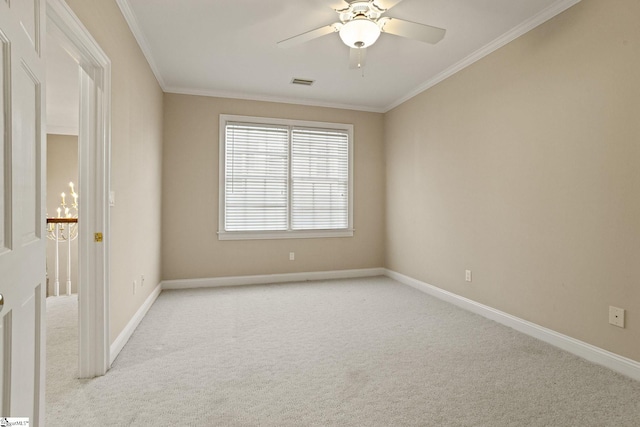 unfurnished room with light carpet, baseboards, and crown molding