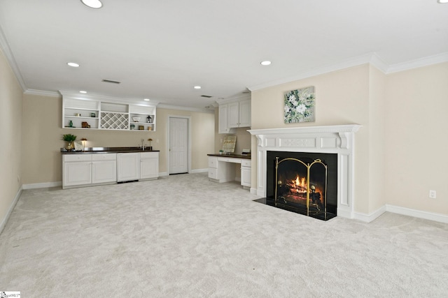 living area featuring ornamental molding, a fireplace with flush hearth, visible vents, and light colored carpet