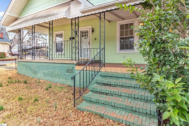 entrance to property with a porch