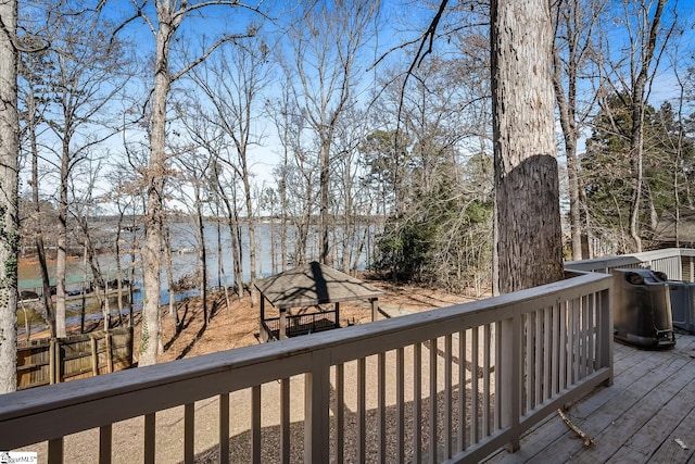 wooden deck featuring a water view