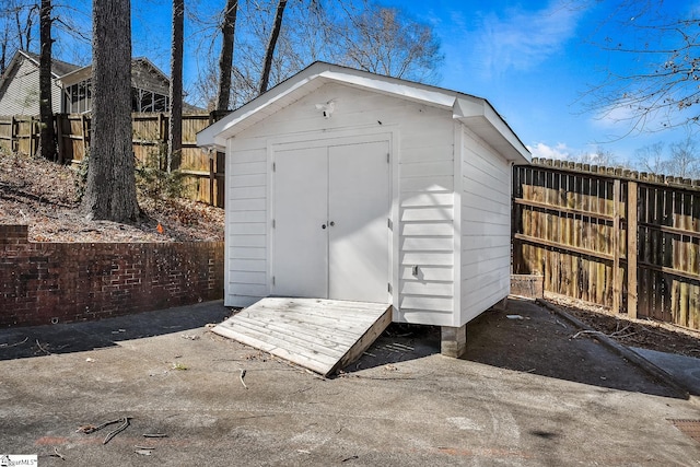 view of shed featuring a fenced backyard