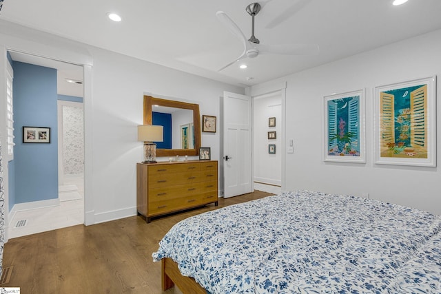 bedroom with recessed lighting, visible vents, dark wood-type flooring, a ceiling fan, and baseboards