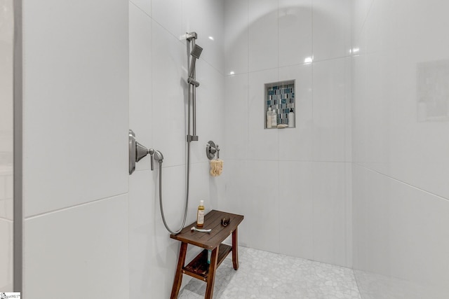 full bathroom with tiled shower