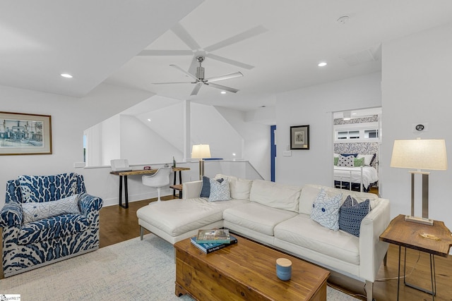 living room featuring a ceiling fan, recessed lighting, baseboards, and wood finished floors