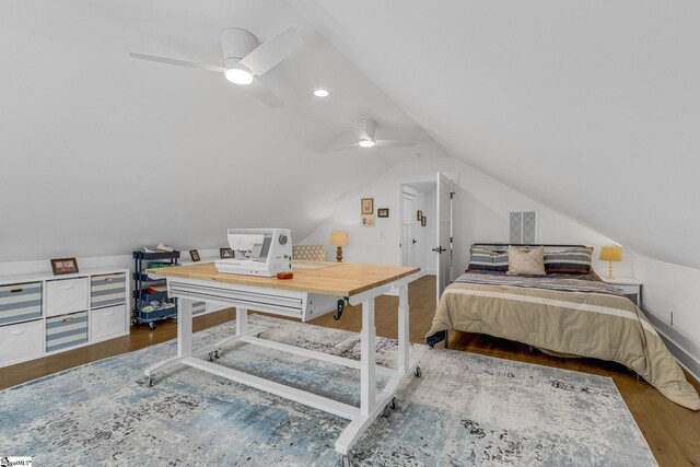 bedroom featuring lofted ceiling, ceiling fan, visible vents, and wood finished floors