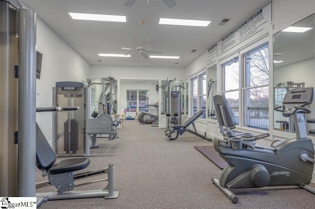 workout area featuring ceiling fan and visible vents