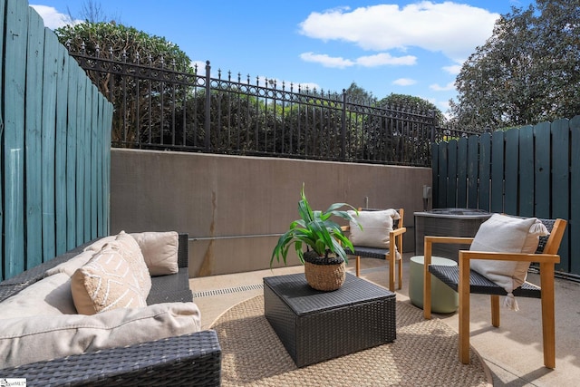 view of patio featuring an outdoor hangout area, fence, and central air condition unit