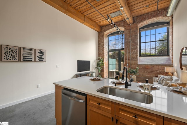 kitchen featuring a sink, brick wall, wooden ceiling, concrete floors, and dishwasher