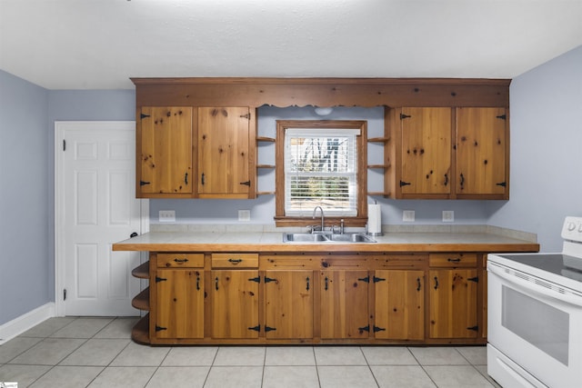 kitchen featuring light tile patterned flooring, a sink, brown cabinets, open shelves, and white electric range oven