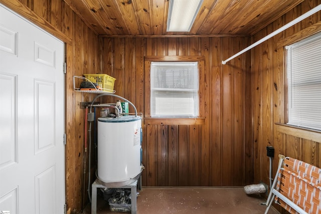 utility room featuring water heater