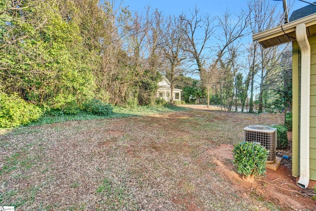 view of yard featuring central AC unit