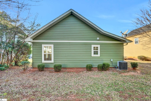 view of side of home with cooling unit