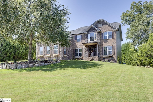 craftsman-style house featuring crawl space, brick siding, and a front yard