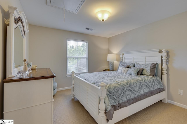 bedroom featuring light carpet, visible vents, attic access, and baseboards