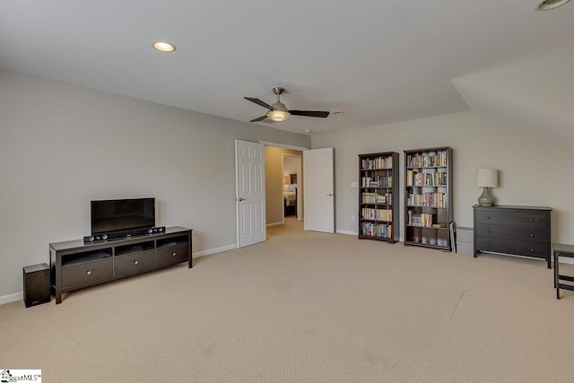 living area featuring carpet floors, baseboards, a ceiling fan, and recessed lighting