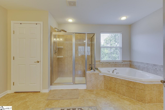 bathroom featuring a bath, tile patterned flooring, a shower stall, and visible vents