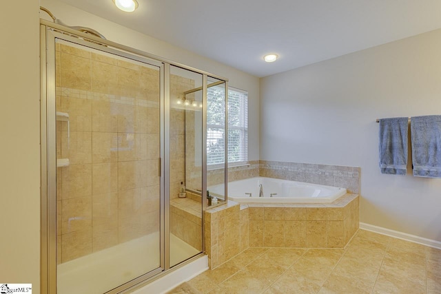 full bath featuring baseboards, tile patterned flooring, a garden tub, and a shower stall