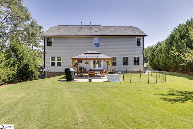 rear view of house featuring a lawn, a patio, crawl space, fence, and a gazebo