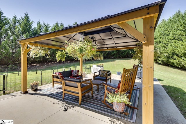 view of patio / terrace with fence, a gazebo, and an outdoor hangout area