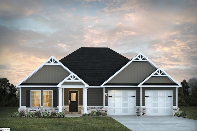 craftsman house featuring driveway, a shingled roof, a garage, and a lawn