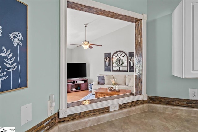 living room with lofted ceiling and ceiling fan