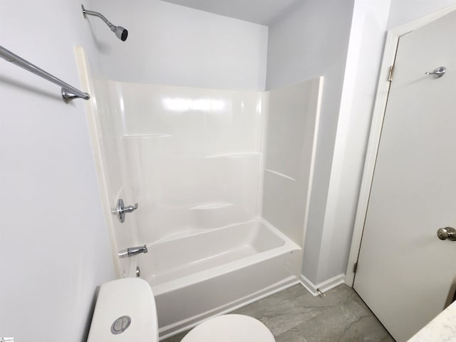 bathroom featuring bathing tub / shower combination and toilet