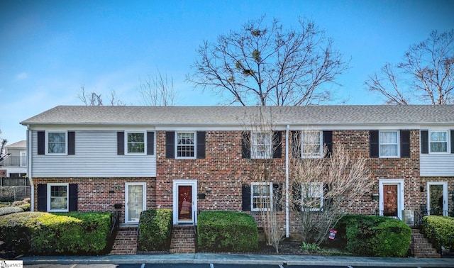 view of front of home with brick siding