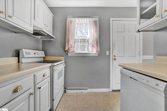 washroom featuring laundry area and baseboards