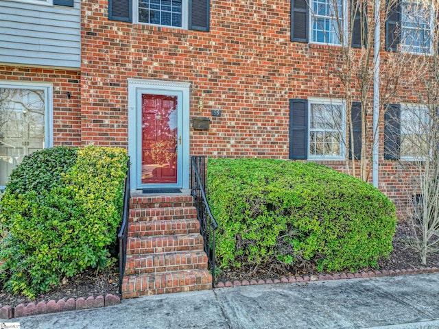 entrance to property with brick siding