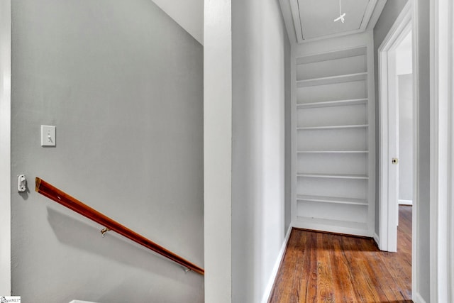 interior space with attic access and wood finished floors