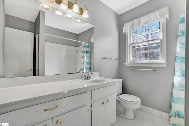 bathroom featuring baseboards, toilet, curtained shower, tile patterned flooring, and vanity