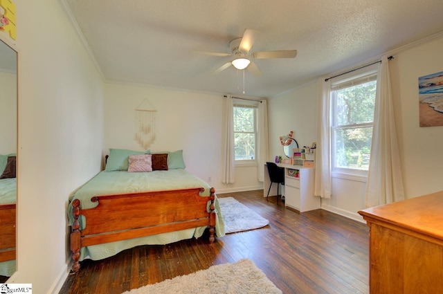 bedroom featuring ornamental molding, a ceiling fan, a textured ceiling, and wood finished floors