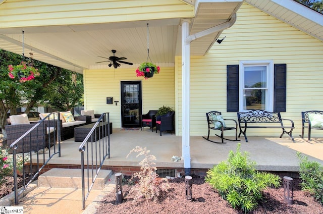 view of patio with an outdoor living space and a ceiling fan