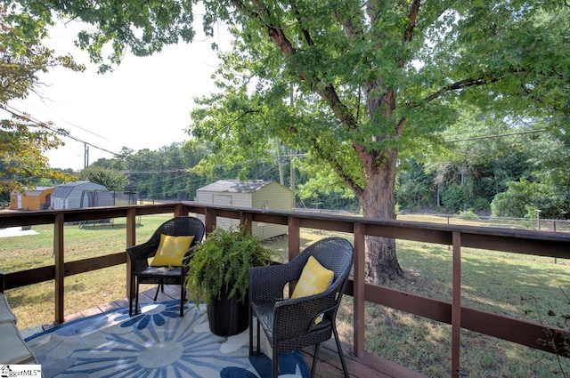 wooden deck with fence and a yard