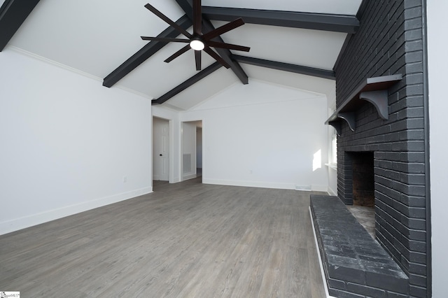 unfurnished living room featuring a brick fireplace, wood finished floors, a ceiling fan, and baseboards