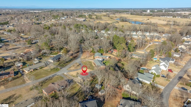 birds eye view of property with a water view and a residential view