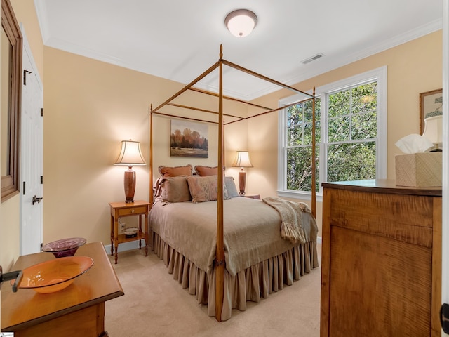 bedroom featuring visible vents, light colored carpet, and ornamental molding