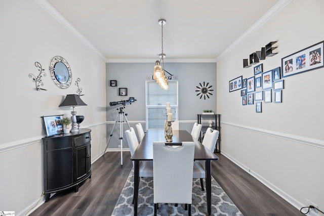 dining space with baseboards, dark wood finished floors, and crown molding