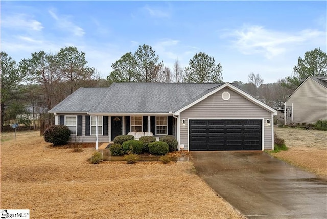 single story home featuring driveway, covered porch, an attached garage, and a shingled roof