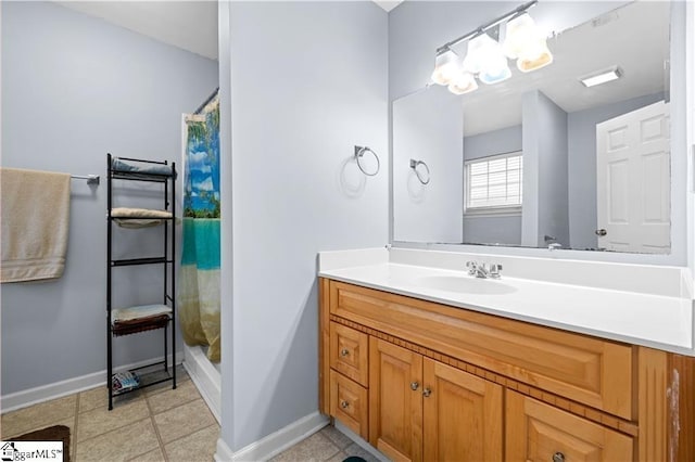 full bath featuring tile patterned floors, vanity, baseboards, and a shower with shower curtain