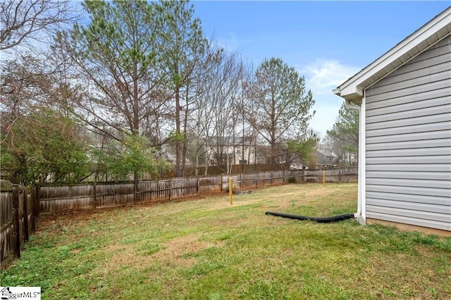 view of yard with a fenced backyard